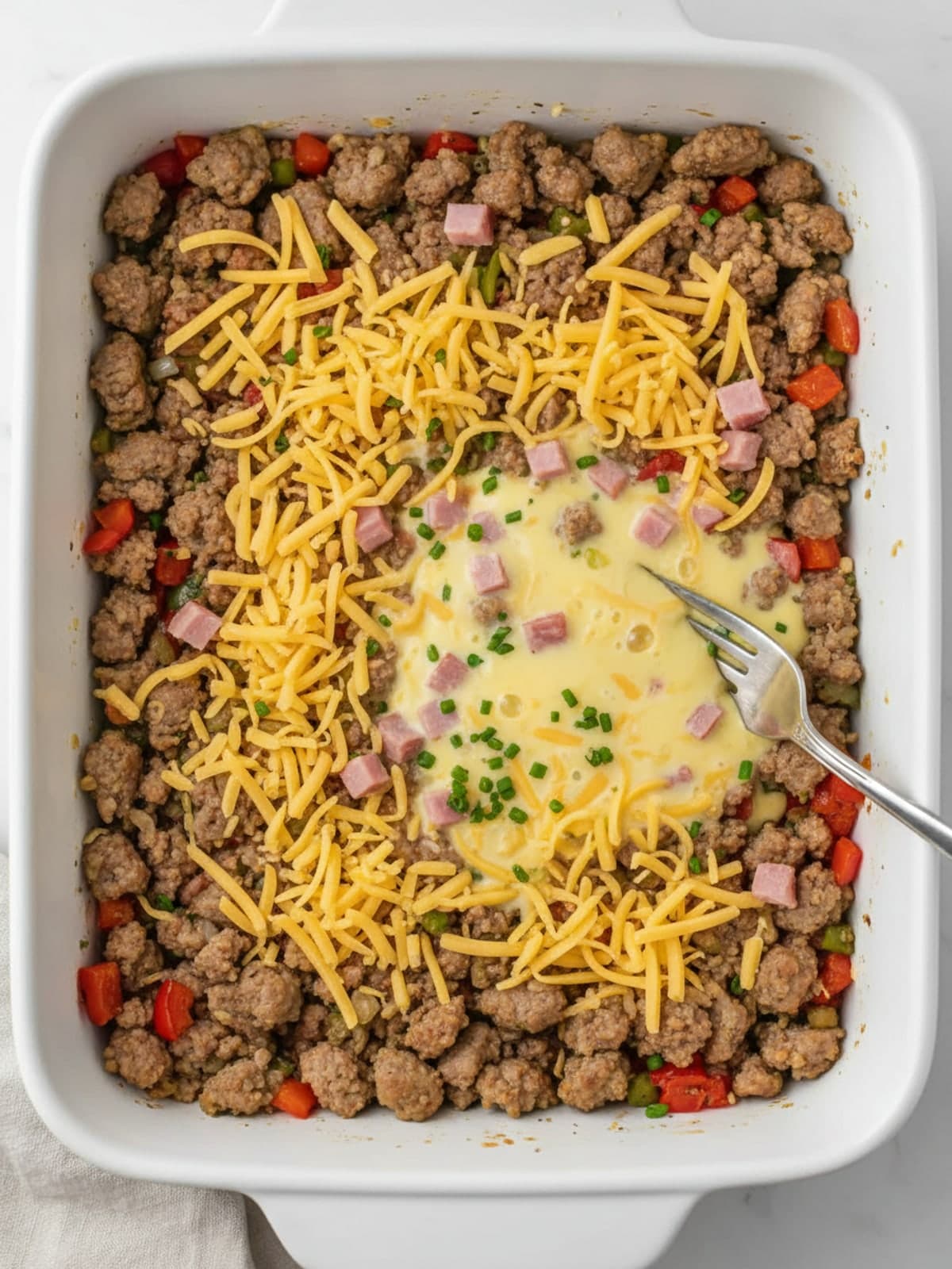 Tater Tot Breakfast Casserole With Sausage and Peppers: Assemble the base